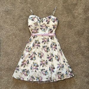 White floral sundress with purple ribbon tie and built in bra